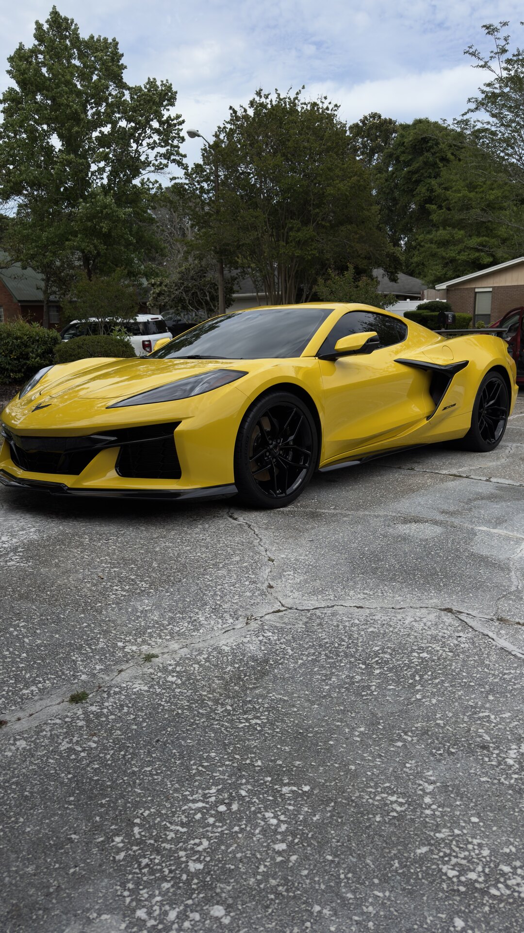 Glossy detailed black luxury car with water beads
